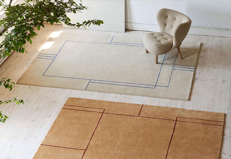  The Cruise rug ﻿by ﻿All the Way to Paris ﻿for ﻿&tradition in Bombay golden brown and Aden Desert Beige with the petra chair.